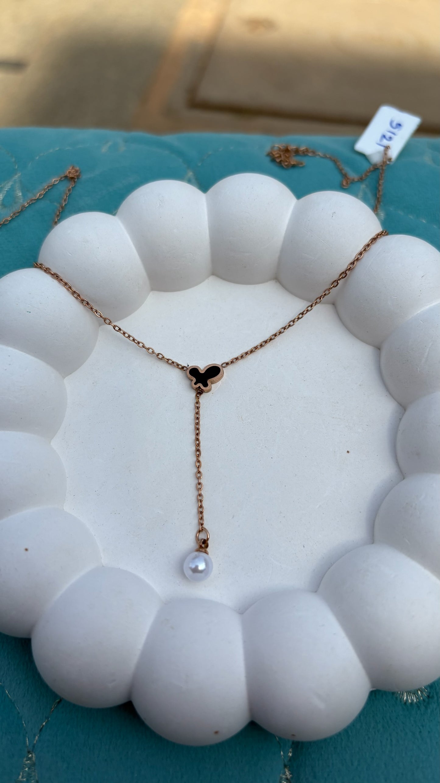 Butterfly hanging pearl